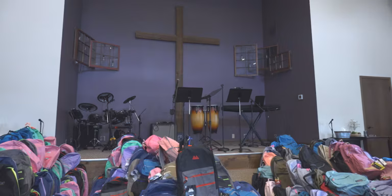 Local Church Distributes Over 1,000 Backpacks to Students in Need
