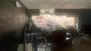 Flash floods cause wall collapse at McNewton’s Community Outreach Center, prompting fundraiser for repairs