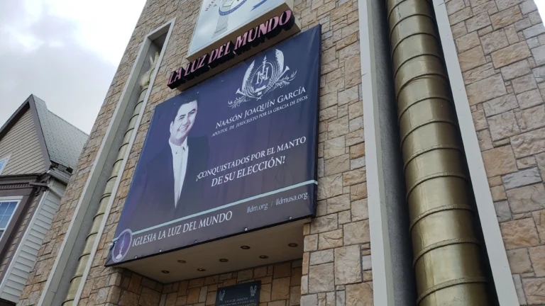 South Side church defends decision to keep banner featuring accused child rapist