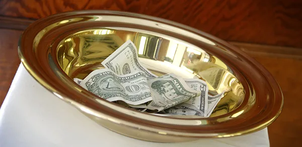 Churchgoers Say They Tithe But Not Always to the Church