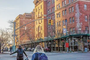 The shelter relocation to East Village faces legal challenge as residents seek to block the move.